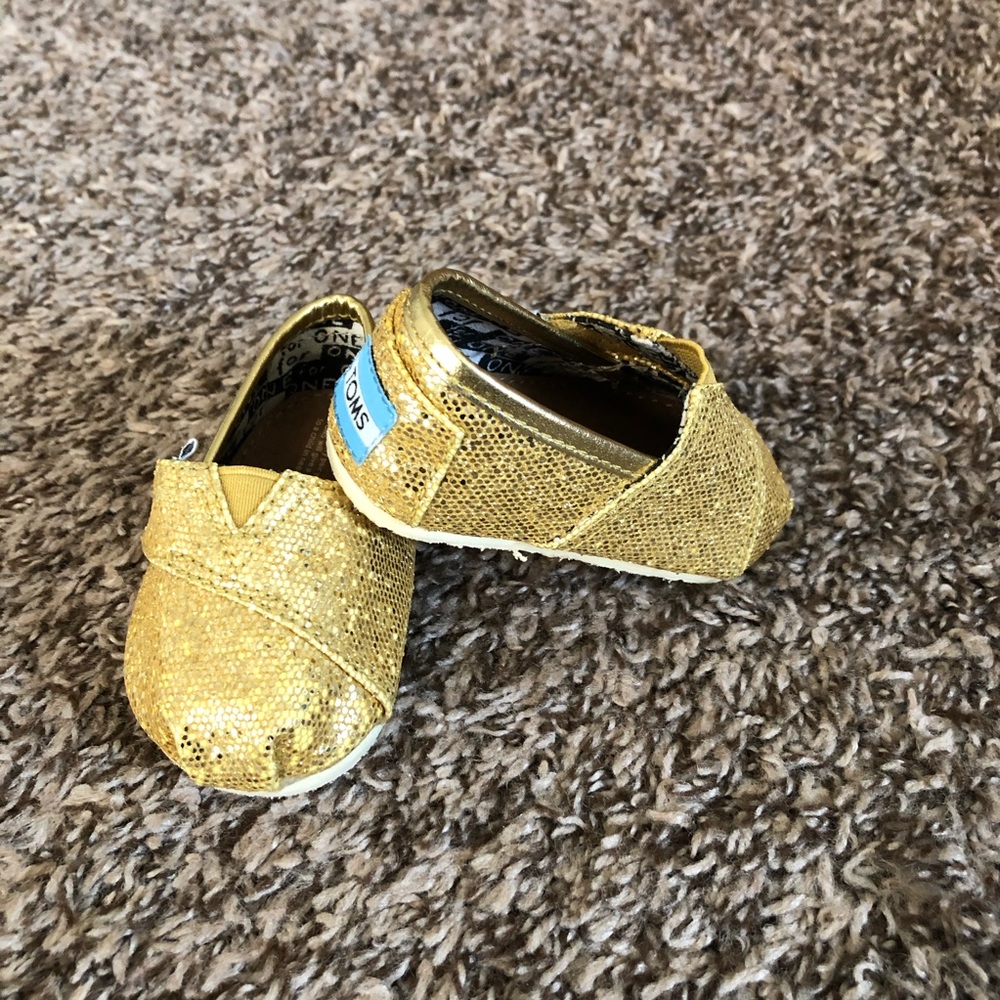 Tiny Toms gold glitter shoes